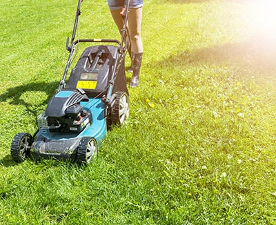 Girl Cuts The Lawn